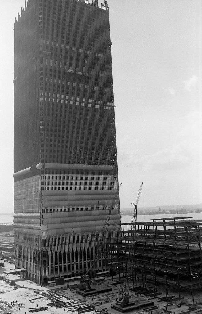 Construction of Tower One (North Tower) of the World Trade Center is well underway.