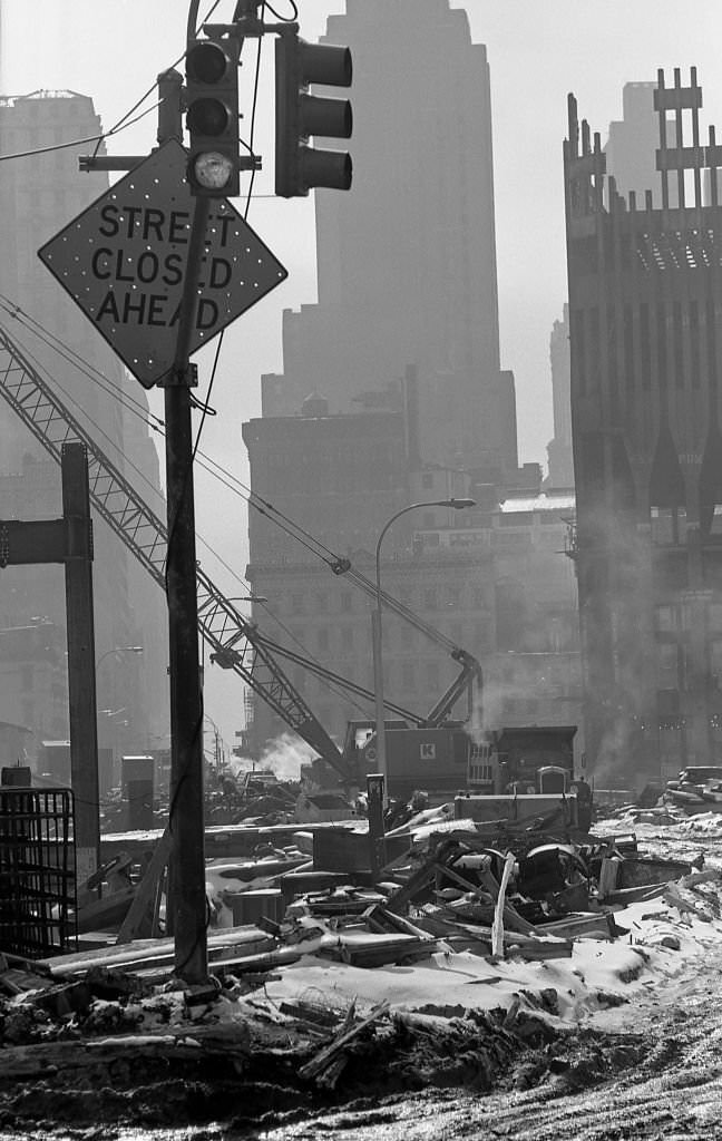 Construction cranes sit on snow covered dirt as Towers One and Two of the World Trade Center are erected in the winter of 1970