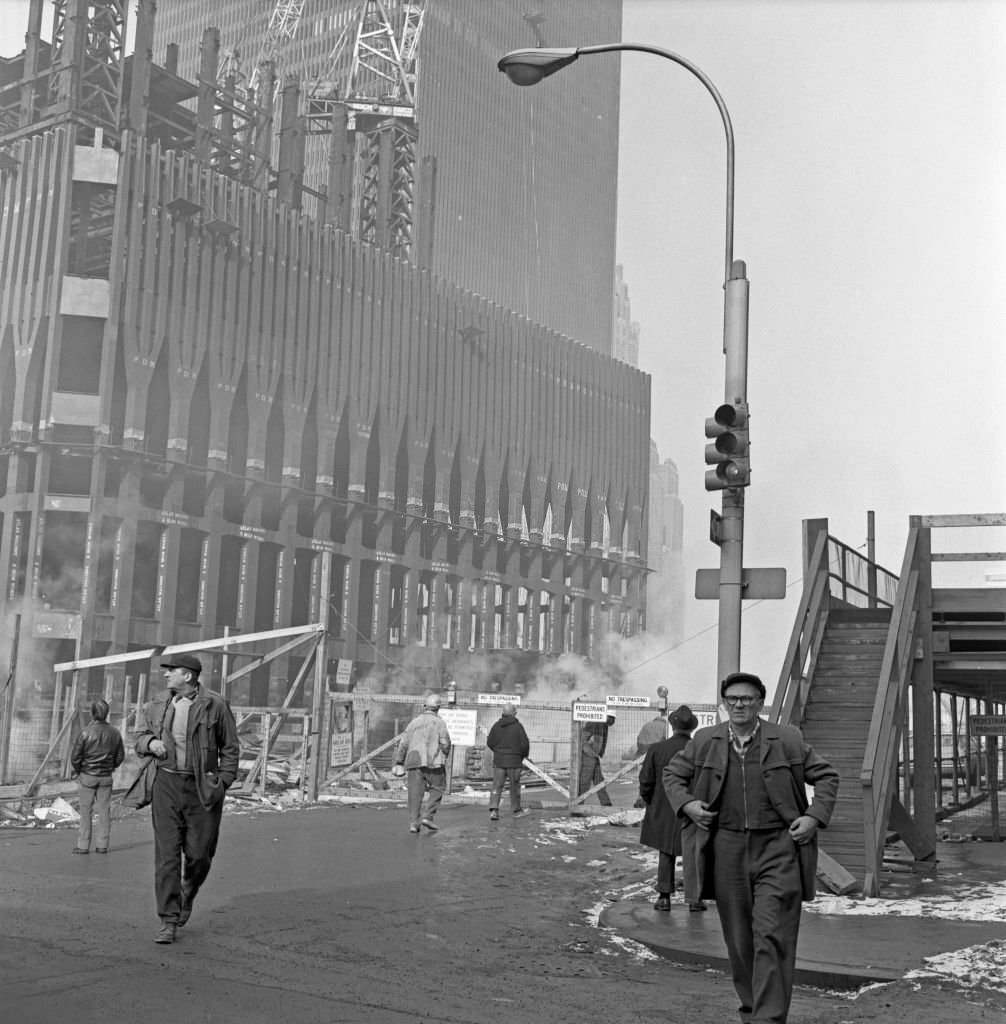 Workers enter and leave the World Trade Center construction site in Downtown Manhattan during the Winter of 1970