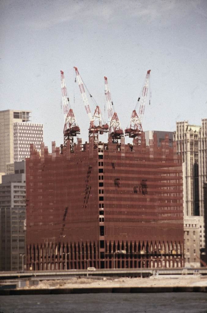 View from the Hudson River of the first tower of the World Trade Center under construction, 1970.