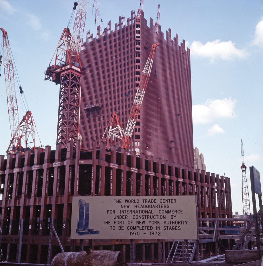 View, looking northwest, of partially completed structures at the construction site for the World Trade Center complex, 1969