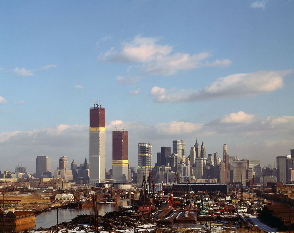 New York: Views of the World Trade Center (both of its twin towers still under construction) and Manhattan skyline views taken from New Jersey shore.