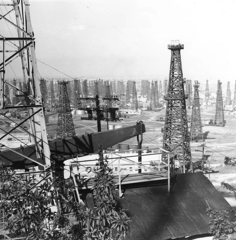 An oil field covered with derricks in an unidentified area of Los Angeles.