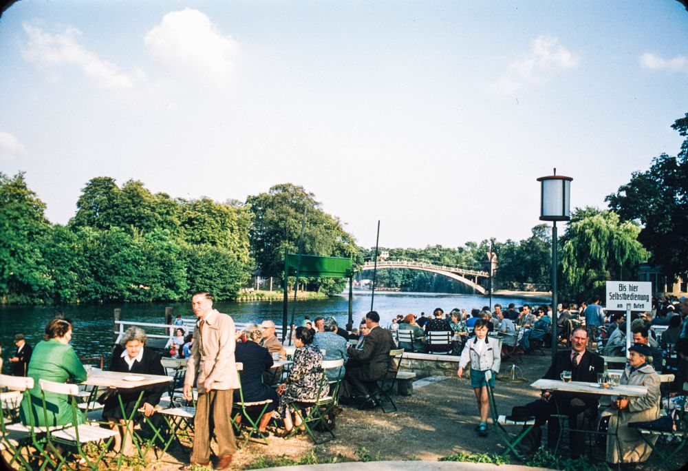 This shot shows the same bridge from farther away, with Berliners enjoying a drink in the foreground.