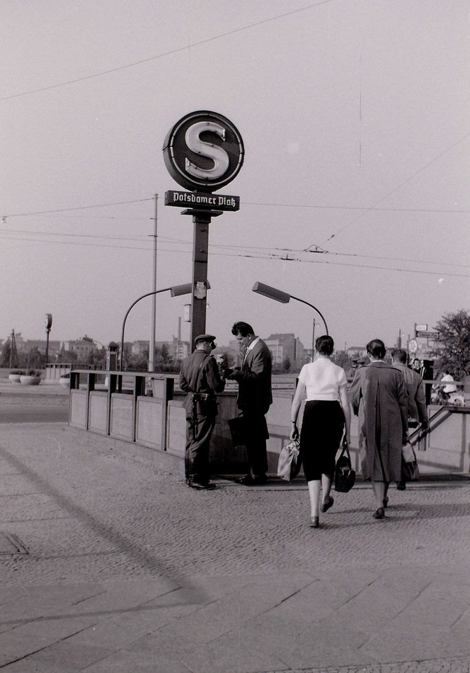 The People's Police checking documents of people entering Potsdamer Platz S-Bahn.