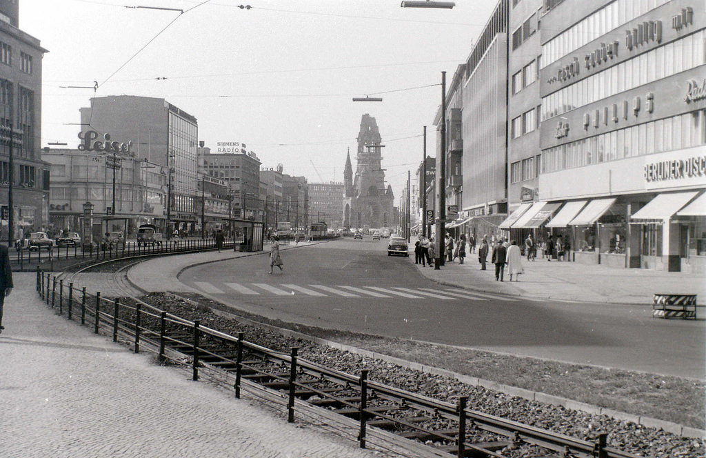 Tauentzienstrasse meets Kurfuerstendamm at the ruin of the Kaiser Wilhelm memorial church, which can be seen in the distance.