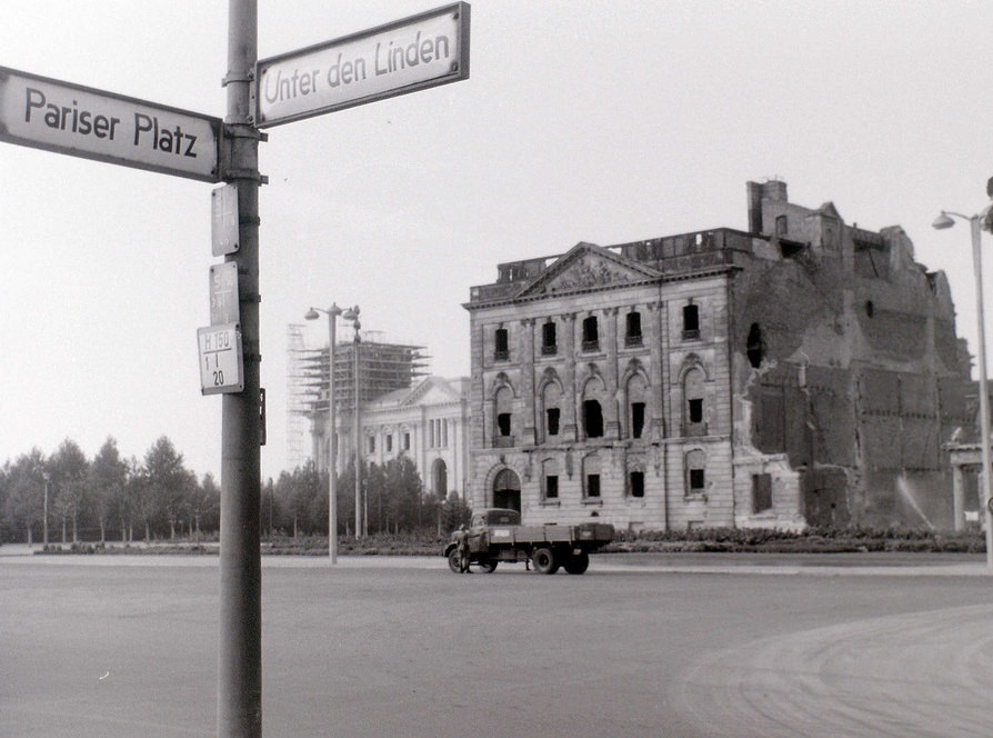 The bombed building was on the north side of Unter den Linden in East Berlin, very near the Brandenburger Tor, with the Reichstag beyond it being in West Berlin.