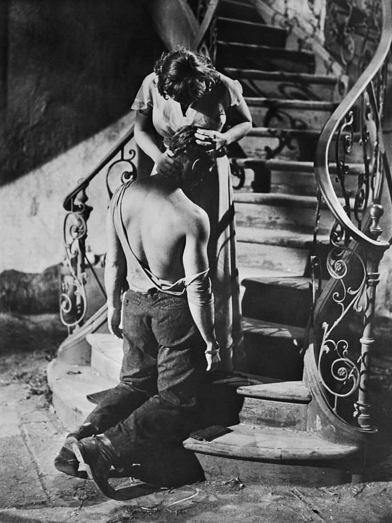 Marlon Brando and Kim Hunter share a scene in the film 'A Streetcar Named Desire'