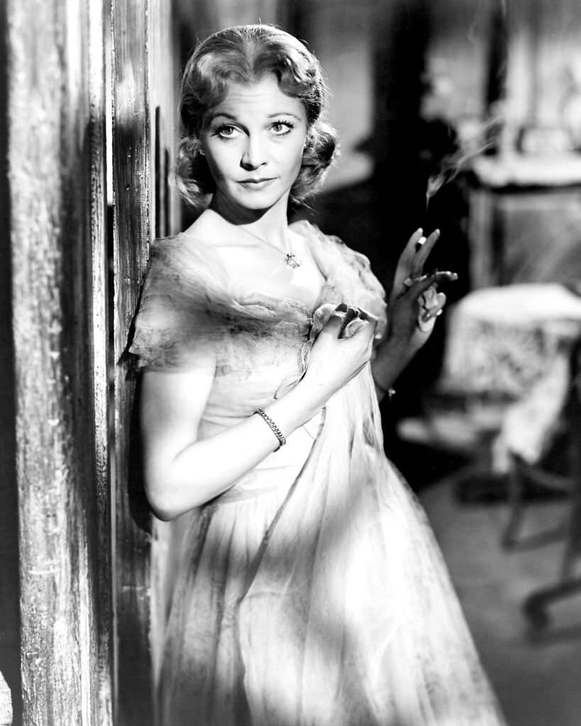 Vivien Leigh holding a lit cigarette in a publicity still issued for the film, 'A Streetcar Named Desire', 1951.