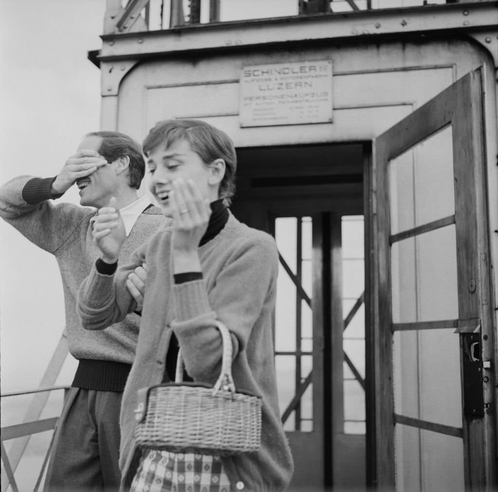 Audrey Hepburn with Mel Ferrer at the top of the Hammetschwand Lift at the summit of the Bürgenstock, Switzerland, 1955.