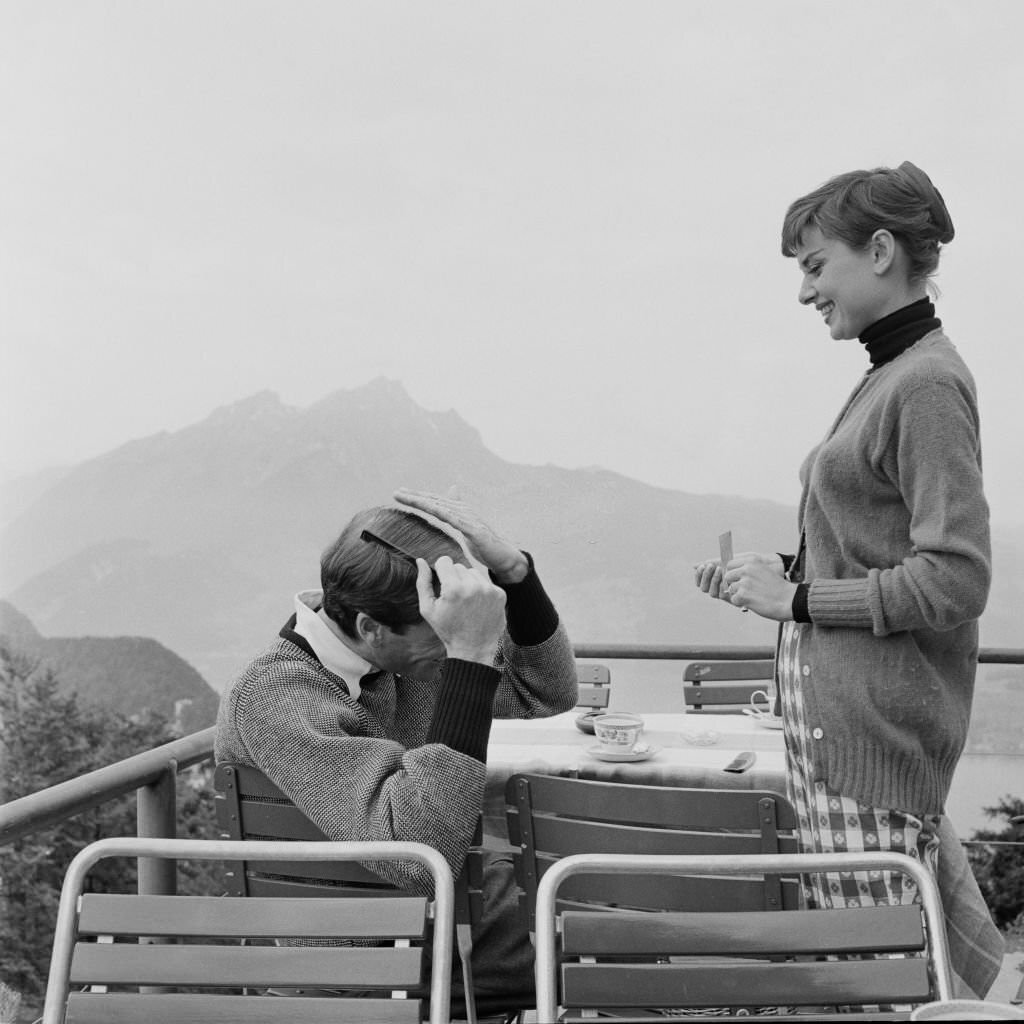 Audrey Hepburn with Mel Ferrer on the terrace of the Restaurant Hammetschwand at the summit of the Bürgenstock, 1955