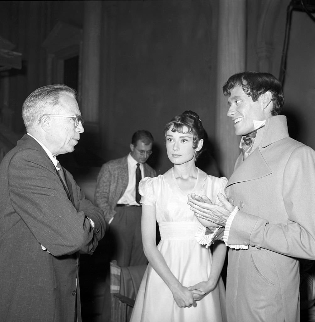 King Vidor, Audrey Hepburn and Mel Ferrer on the movie set of War and Peace.
