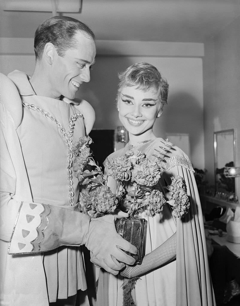 Audrey Hepburn is shown with a bouquet of flowers, after the premiere of "Ondine" at the 46th Street Theater.
