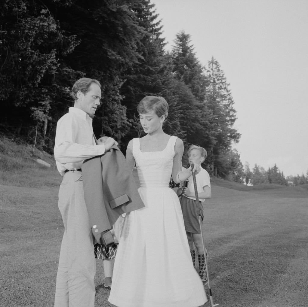 Audrey Hepburn and Mel Ferrer on a golf course at the Bürgenstock resort, Switzerland, 1954.