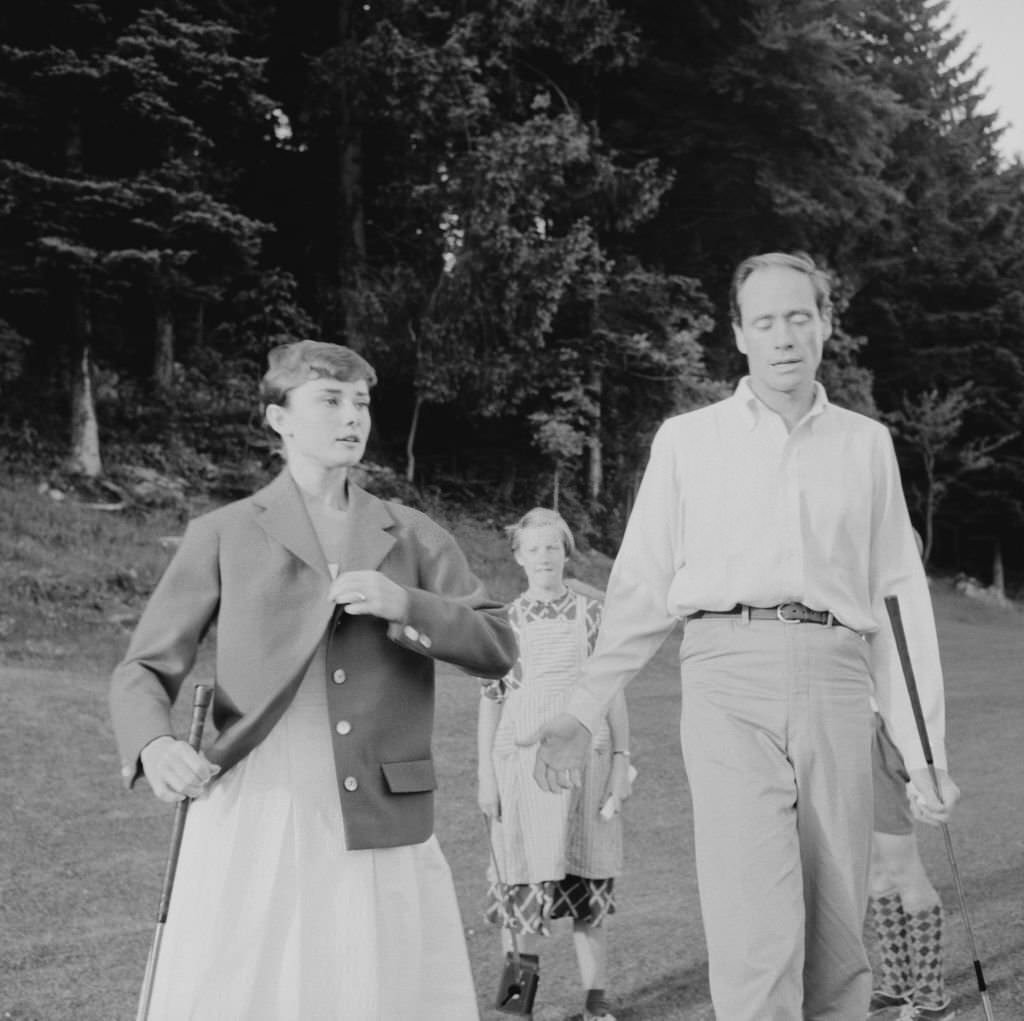 Audrey Hepburn and Mel Ferrer on a golf course at the Bürgenstock resort, Switzerland, 1954.