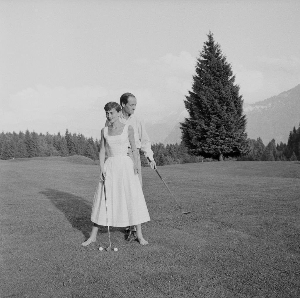 Audrey Hepburn and Mel Ferrer on a golf course at the Bürgenstock resort, Switzerland, 1954.