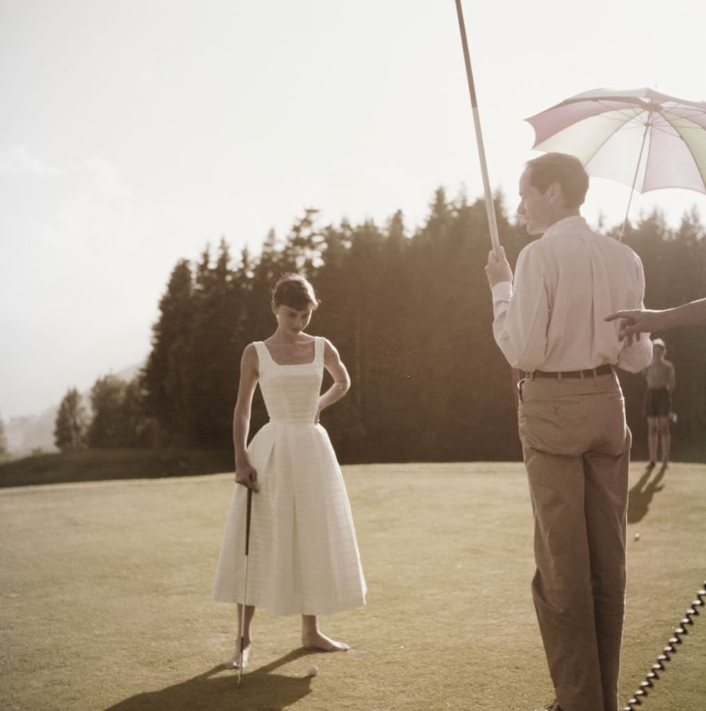 Audrey Hepburn and Mel Ferrer on a golf course at the Bürgenstock resort, Switzerland, 1954.