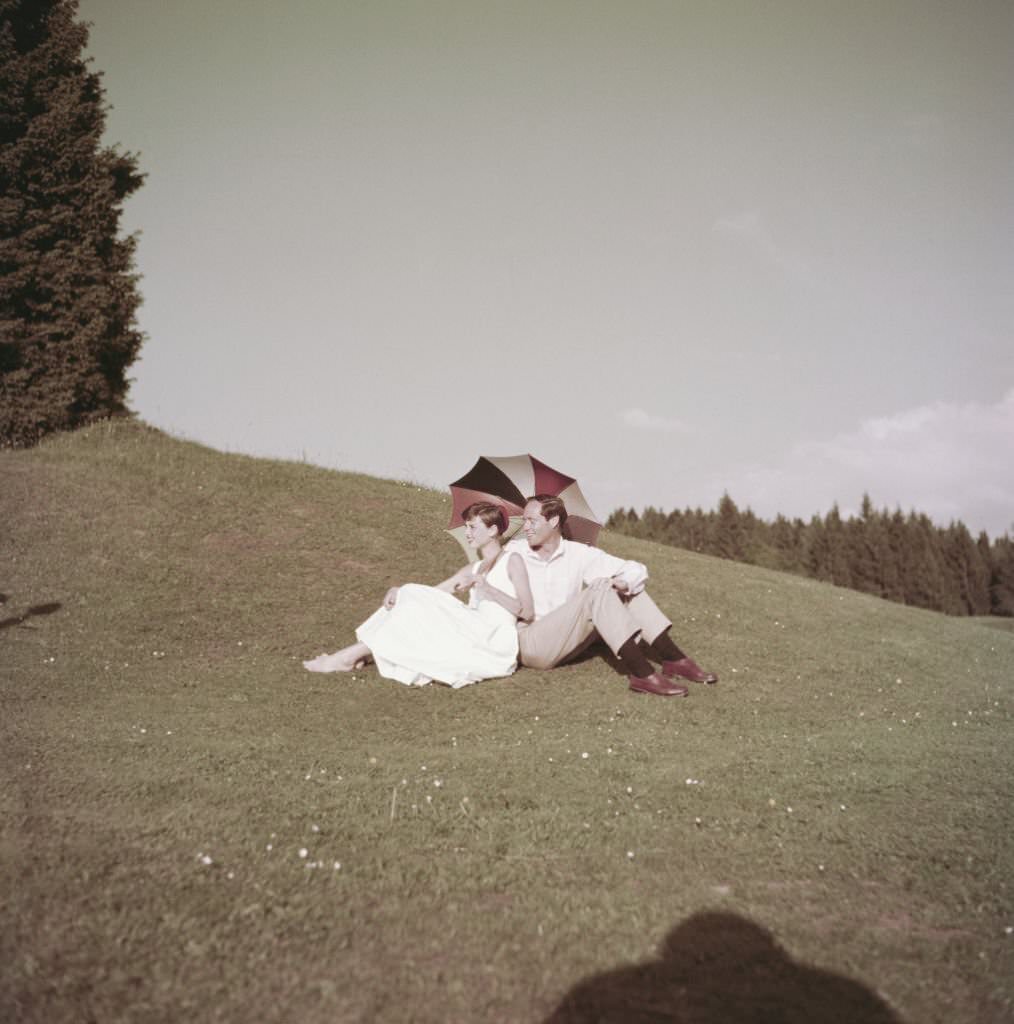 Audrey Hepburn and Mel Ferrer on a golf course at the Bürgenstock resort, Switzerland, 1954.