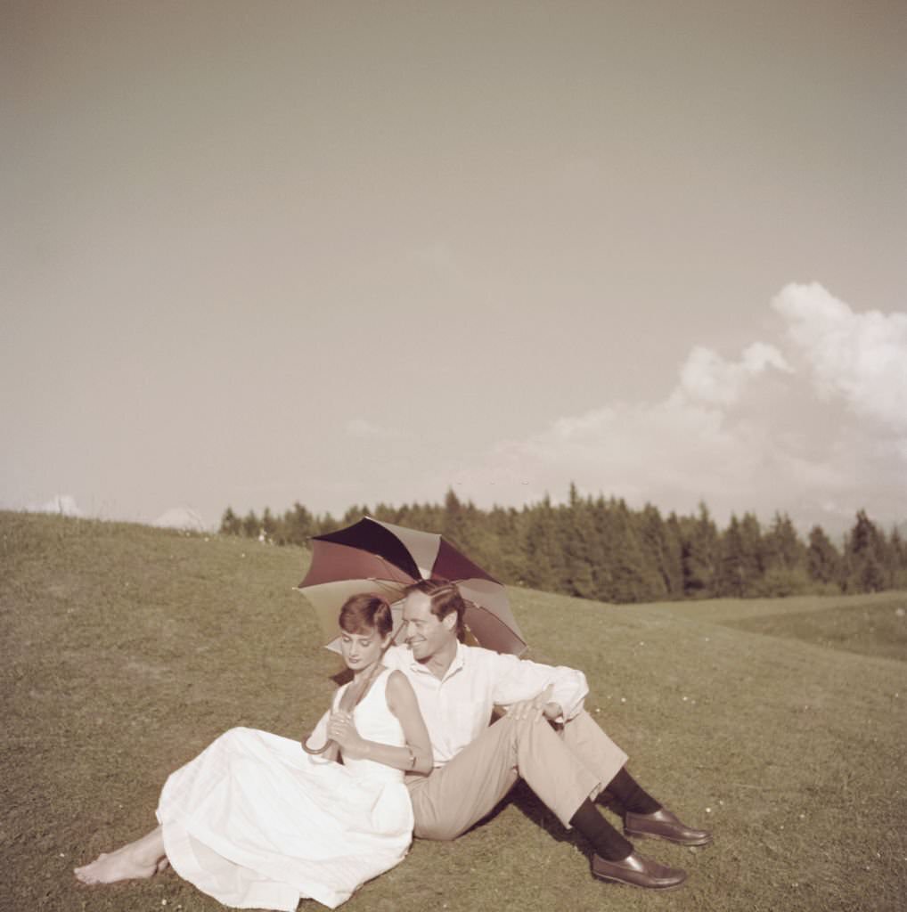 Audrey Hepburn with her husband Mel Ferrer on a golf course at the Bürgenstock resort, Switzerland, 1954.