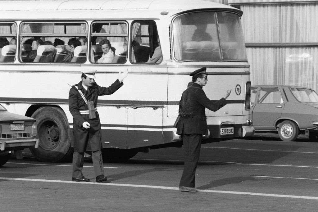 A traffic warden diverting traffic, 1979