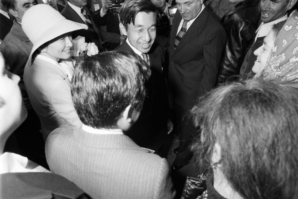 Crown Prince Akihito and Crown Princess Michiko visit a market on October 10, 1979 in Bucharest.