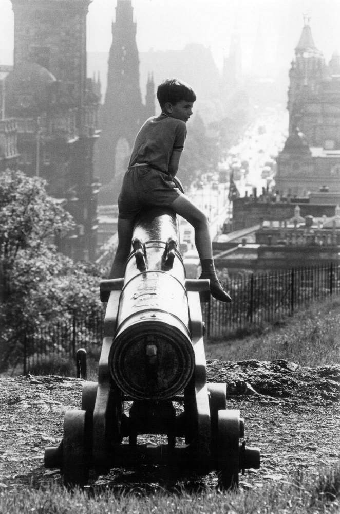 Boy sitting on the cannon at Princes Street, Edinburgh, 1964