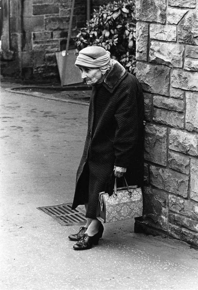 A lady with bag resting, Edinburgh, 1965