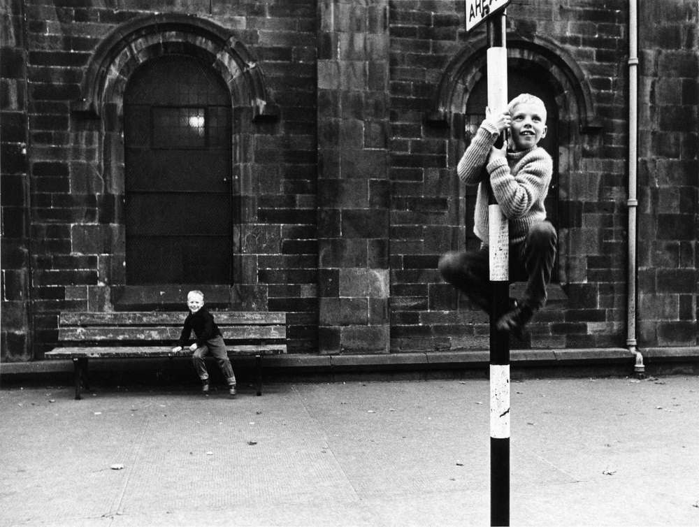 Boy climbing the street sign, Stockbridge, Edinburgh, 1965