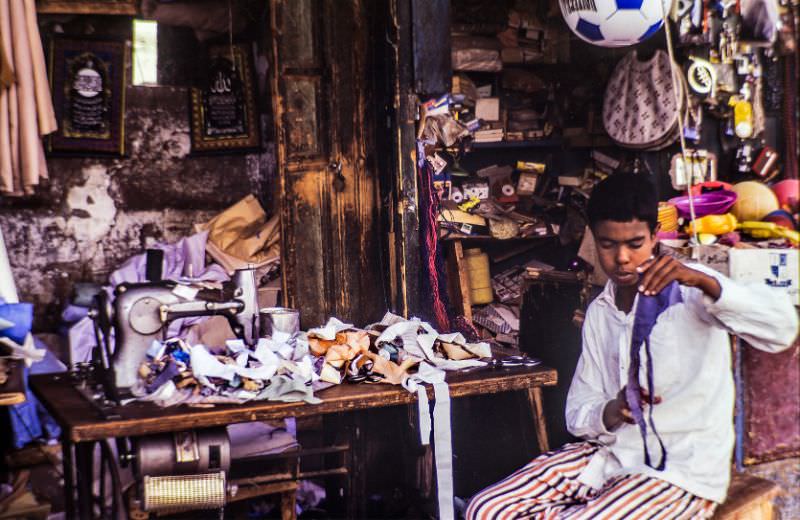 Sewing machine and apprentice, Egypt, August 1981