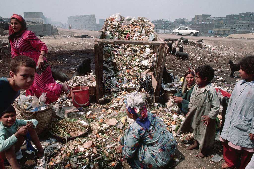 The zabaleen or "garbage people" of Egypt live and scavenge among the city's garbage dumps, recycling items when possible.