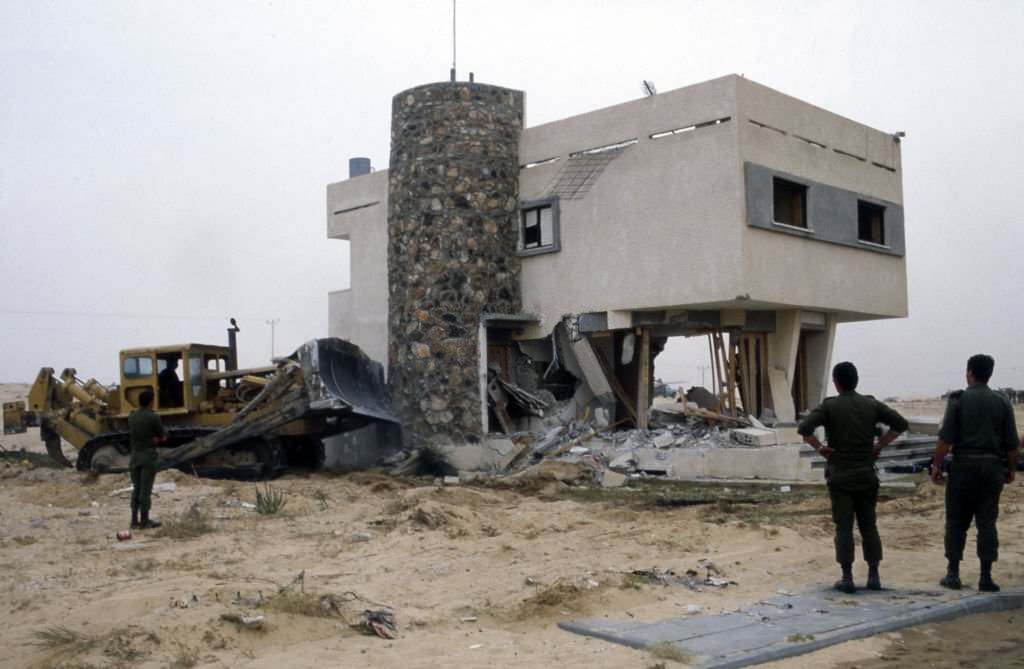 The demolition of the Israeli settlement of Yamit after its evacuation in Sinai in 1982.