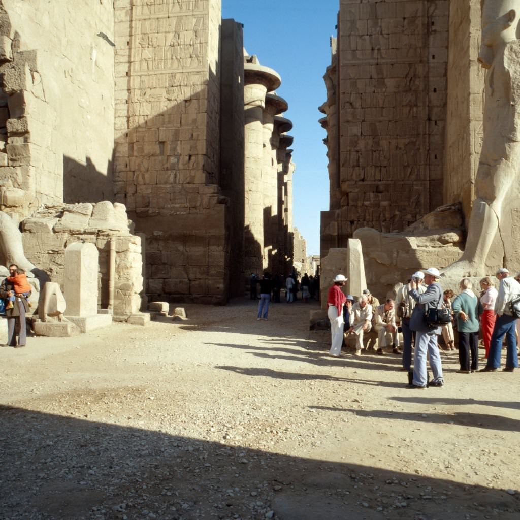 Tourists visiting the remains of Luxor temple, Egypt 1980s.