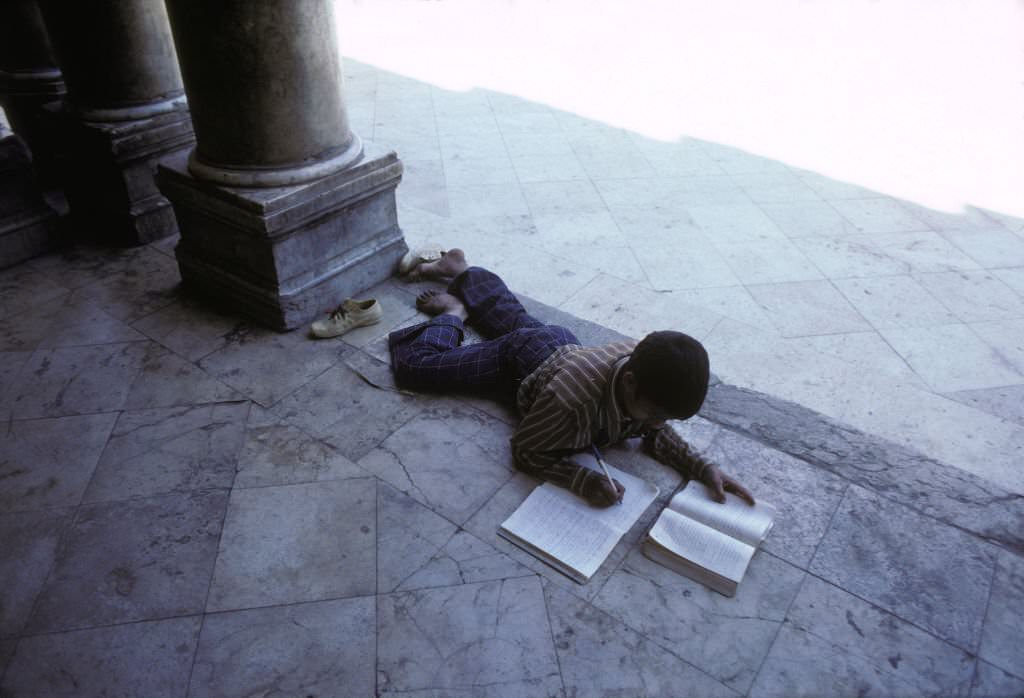 Boy working in a Koranic school (madrasa) in April 1980 in Cairo, Egypt.