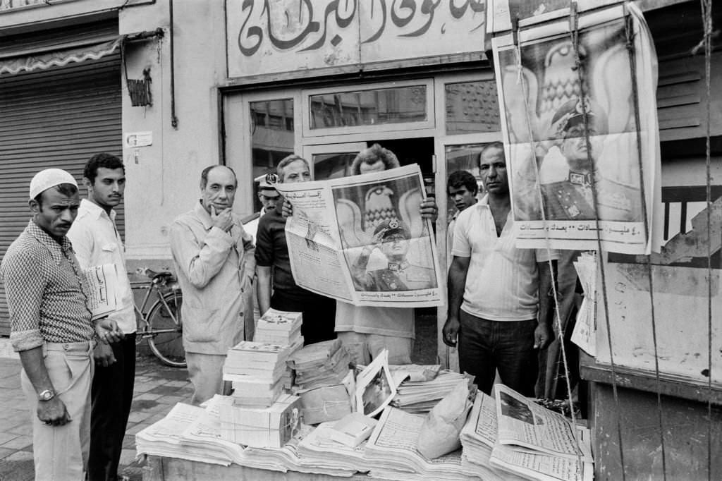 Cairo residents reading the newspaper 2 days after the assassination of President Anwar Sadat, Cairo, 1981
