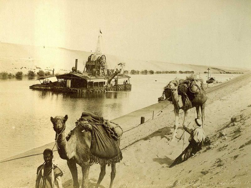Caravan passing a dredging barge
