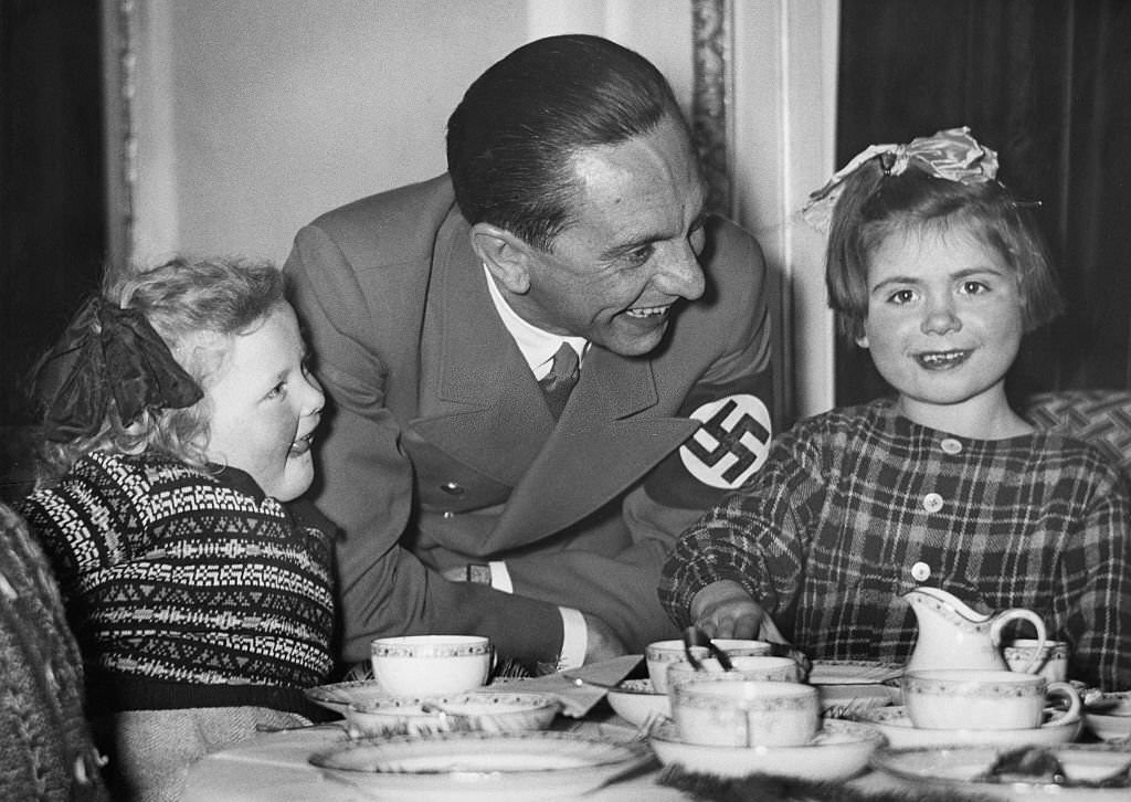 Joseph Goebbels with two little girls at a Christmas party Coffee table