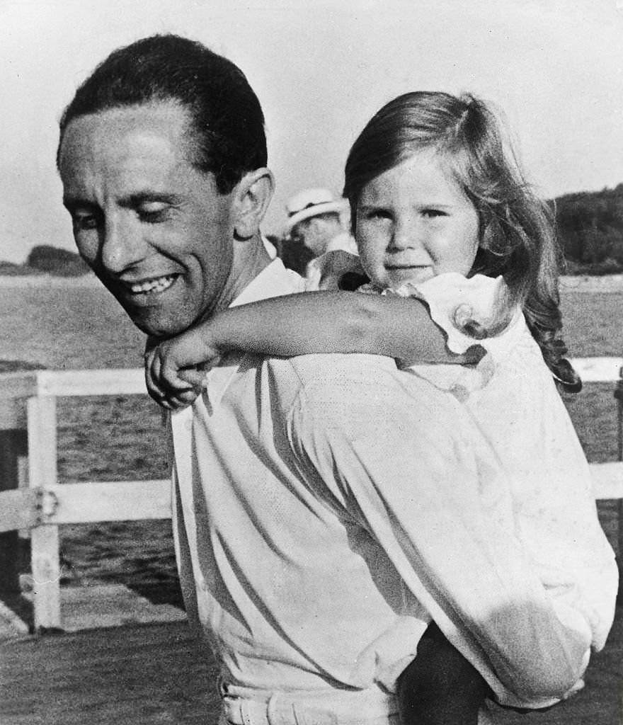 Joseph Goebbels with his daughter Helga during a holiday on the pier of the Mecklenburg Baltic Sea resort of Heiligendamm, 1935