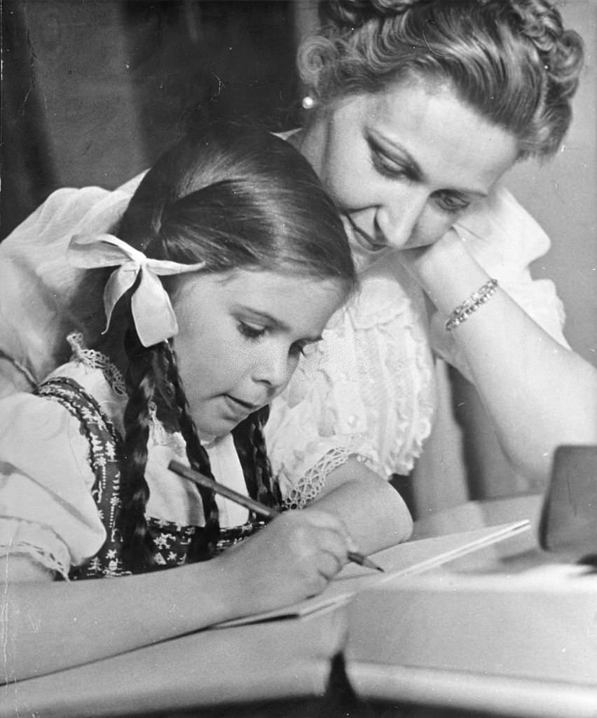 Joseph Goebbels with their daughter Helga doing homework, 1939
