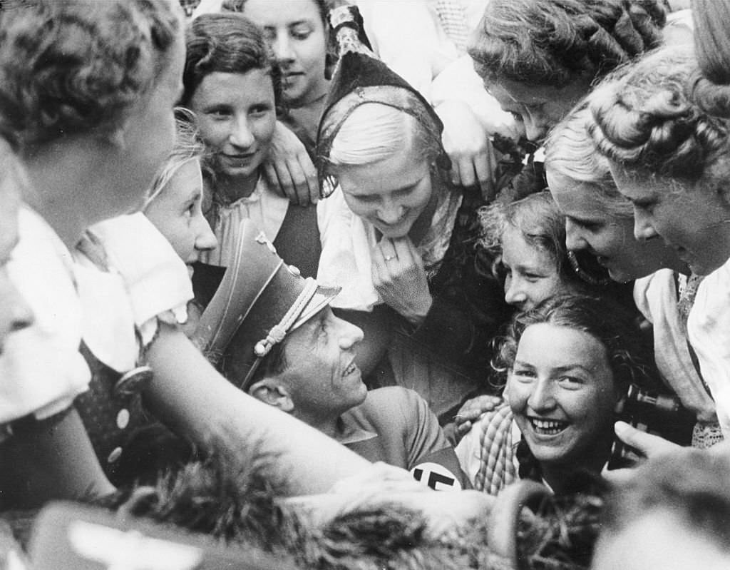 Nuremberg Rally 1938 Joseph Goebbels is surrounded by excited girls from Nazi-occupied Austria during a parade at the Adolf-Hitler-Square in Nuremberg