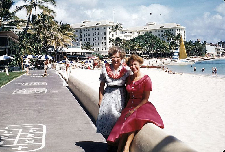 At the Royal Hawaiian Hotel on Waikiki Beach, Honolulu, Hawaii. Outrigger Canoe Club (center left); Moana Hotel (on the right)