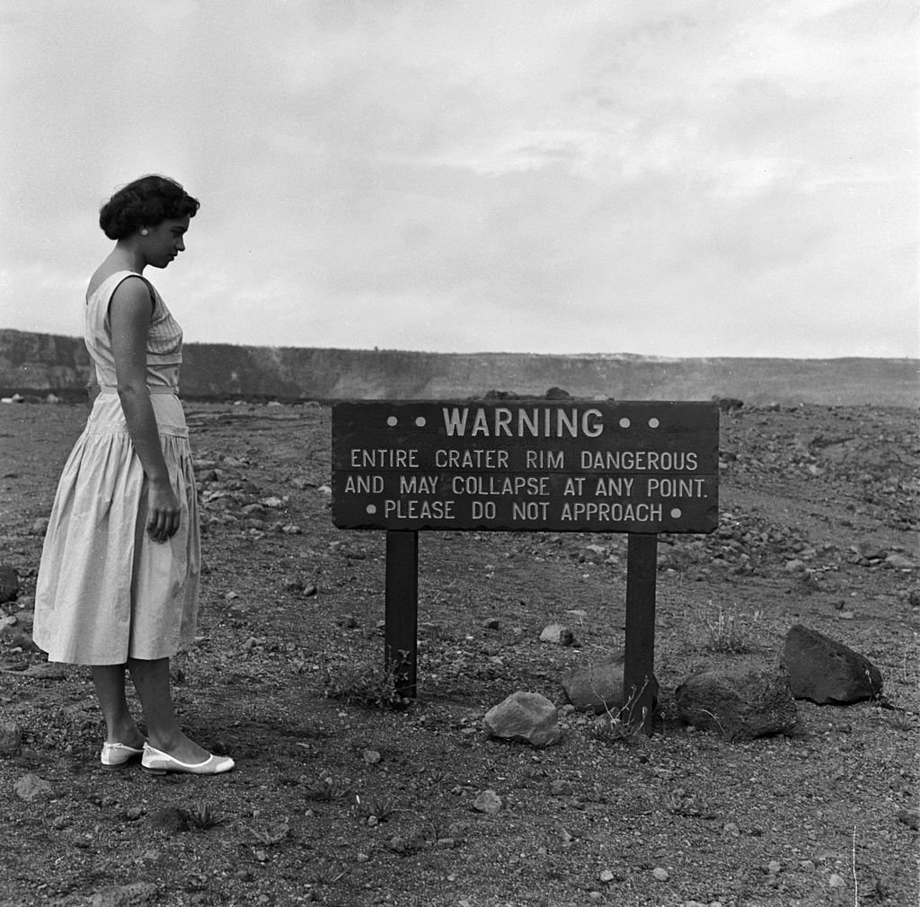 A warning notice near the rim of Halemaumau, or 'House of Evelasting Fire', the inner crater of Kilauea, the world's most active volcanic crater, in Hawaii Volcanoes National Park, 1950