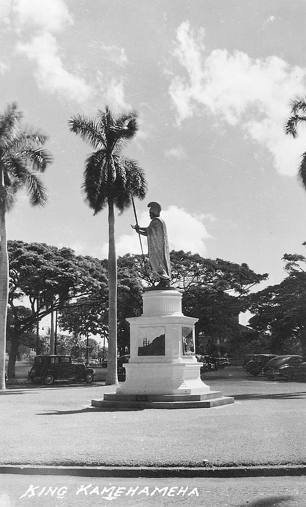 King Kamehameha statue in a peaceful square surrounding by palm trees, Honolulu, Hawaii, 1950.