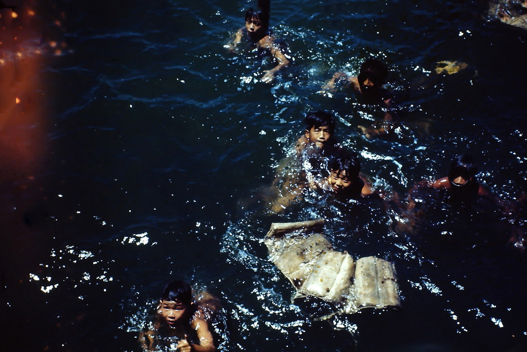 Local boys diving at Waikiki, Hawaii, 1945