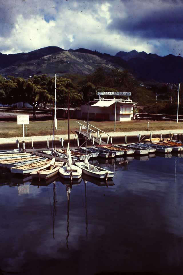 Snug Harbor with boats for rent, Hawaii, 1945
