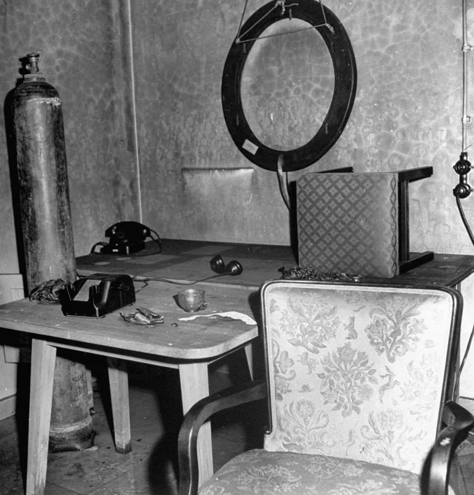 Abandoned furniture and debris inside Adolf Hitler's bunker, Berlin, 1945.