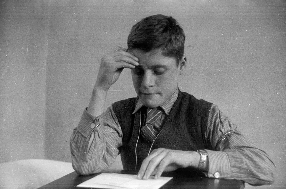 A German refugee studies English at the Dovercourt holiday camp. December 17, 1938.