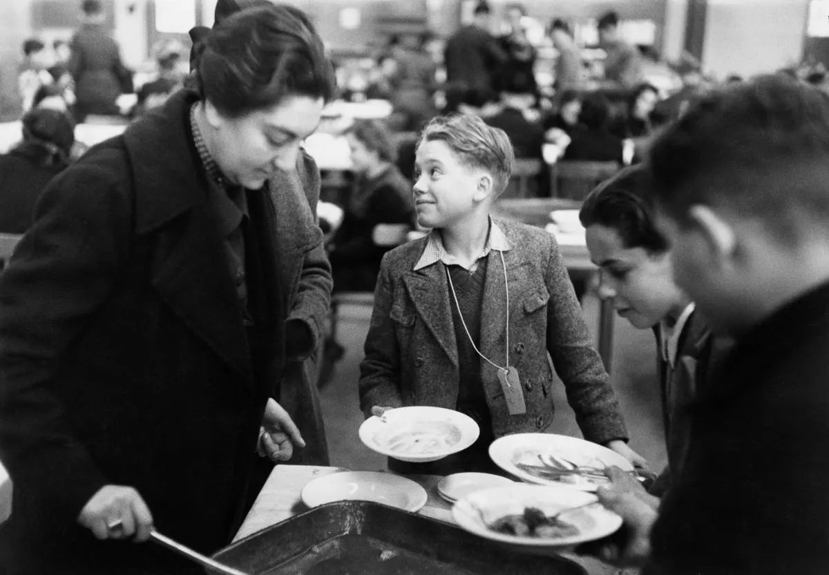 Refugees are served lunch at the Dovercourt Bay Holiday Camp near Harwich in Essex.