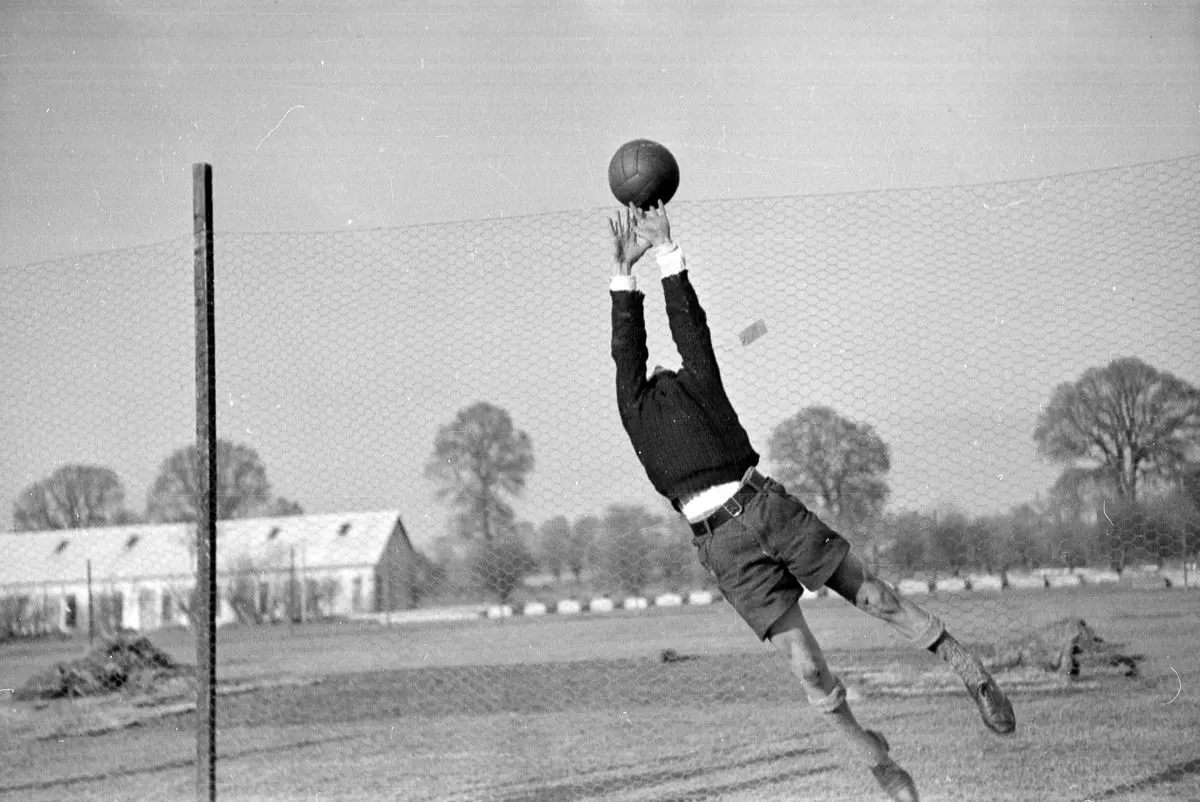 A refugee plays soccer at the Dovercourt holiday camp.