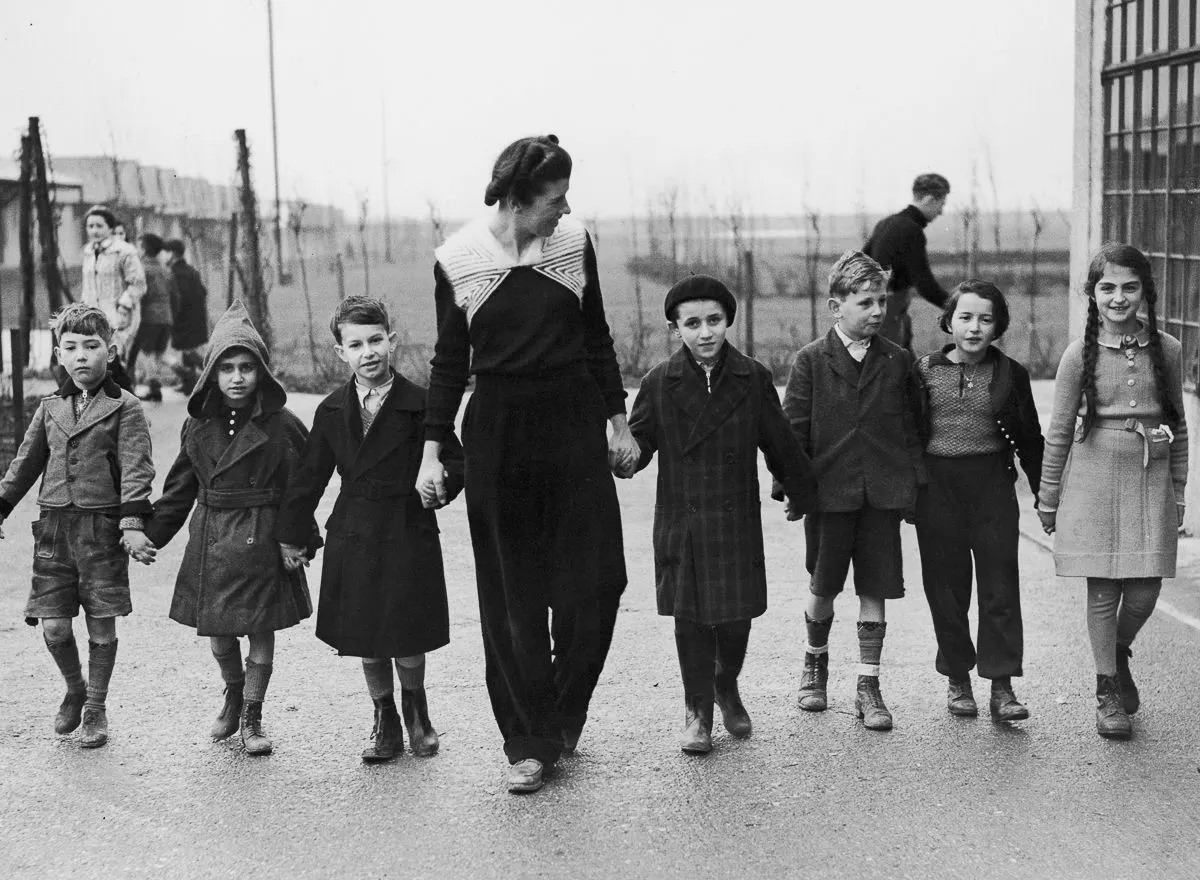 Miss W. Herford leads refugee children on a walk at the Dovercourt holiday camp, 1939.