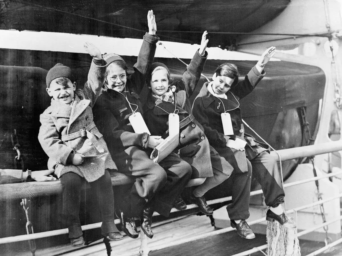 Four of a group of 250 refugees arrive at Southampton on the U.S. ocean liner “Manhattan.” Of the 250 refugees, 88 were unaccompanied children, 1939.